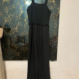 Black long flowy jumpsuit/romper.